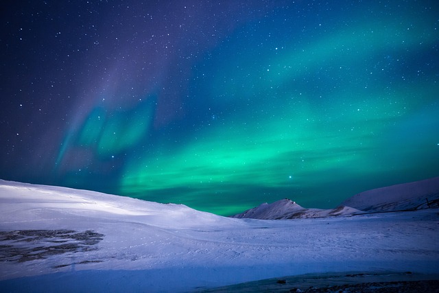 Aurora borealis over an icy arctic landscape